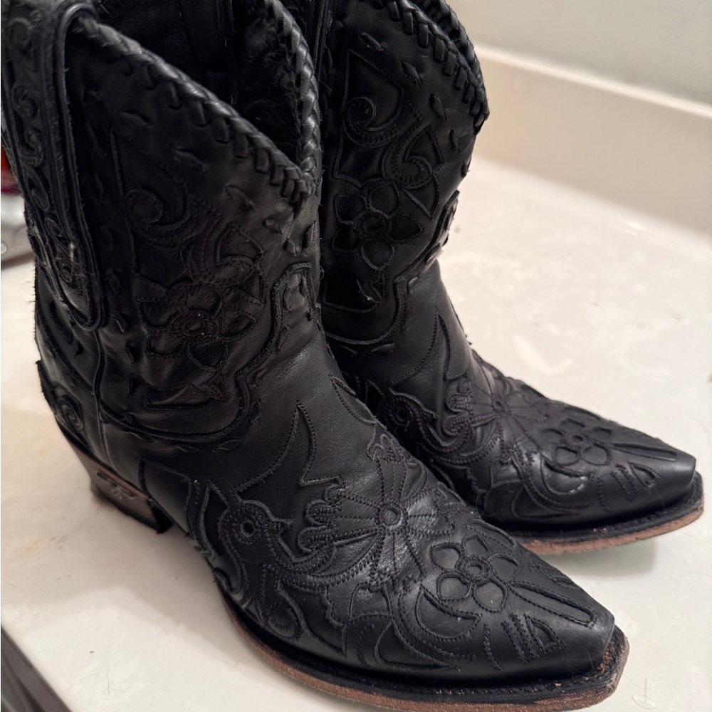 Black Heeled Boots with Intricate Stitching